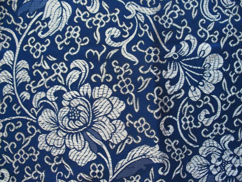 Smooth royal blue background with metallic silver and blue bamboo.